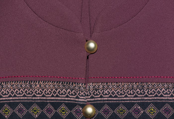 Generally Thai traditional silk shirt with gold button.