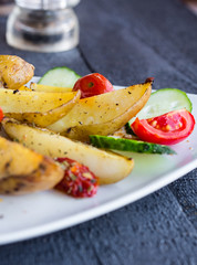 baked potato, tomatoes and cucumbers
