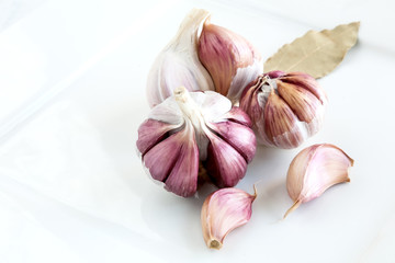 Garlics on wooden board