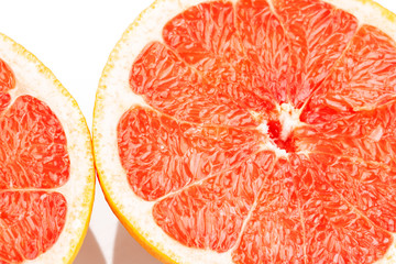 Slice of grapefruit on white background