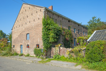 Fototapeta na wymiar House along a road through the countryside