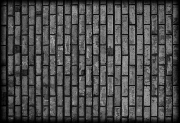 Background of dark black brickwall texture.