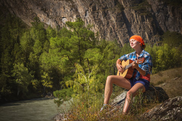 tourist girl playing a guitar