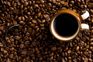 Cup of coffee and coffee beans