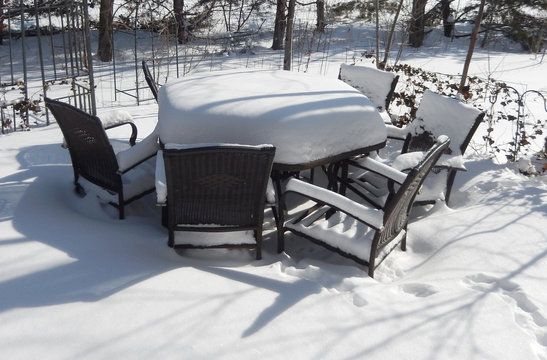 Patio covered with snow on a bright winter day