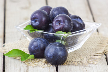 fresh plums in a bowl
