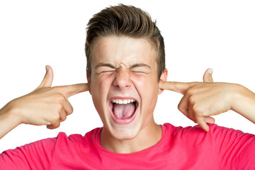 Teen blocking ears with fingers.