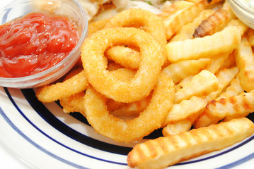 Serving of Onion Rings and French Fries