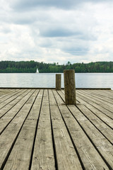 Old wooden pier with docking poles