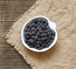 Dried black chickpea on a wooden table