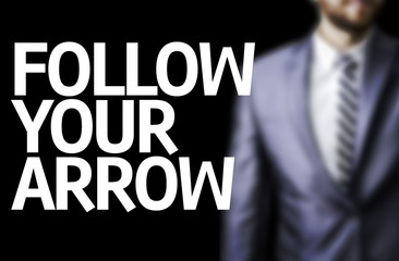 Follow your Arrow written on a board