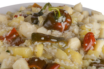 vegetable stew with sweet peppers and rice on a plate, isolated