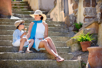 Mother and her little son outdoors in city