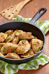 Dumplings fried with onion