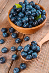 Delicious blueberries on table close-up