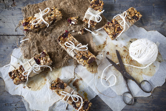 homemade rustic granola bars on vintage wooden background