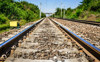 Fototapeta na wymiar Railroad tracks in Romania, main rail line across the country.