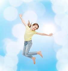 Fototapeta na wymiar smiling little girl jumping