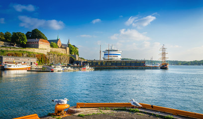Askershus and Oslo fjord harbor at sunset, Norway