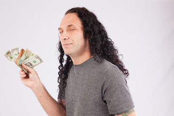 Man holding money and smiling