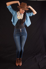 woman in brown hat standing