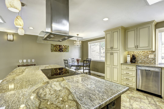 Beautiful kitchen island with granite top, built-in stove and ho
