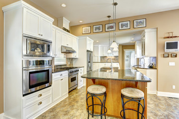 Kitchen room with island and  white storage combination