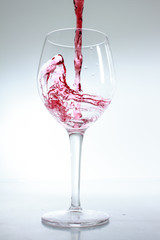 Red wine poured in a glass