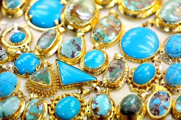 Golded jewel with turquoise