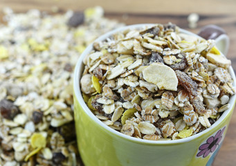Fantastic muesli with nuts on wooden table