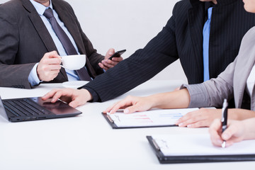 Boss using phone and drinking coffee