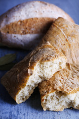 Fresh baked bread on wooden background