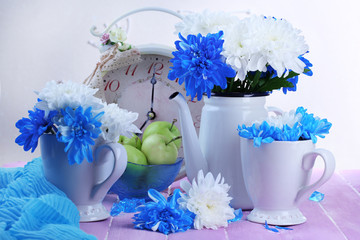 Composition of white and blue chrysanthemum and utensil