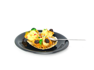 spoon snap off a peace of fruit cake on white background