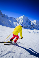 Skiing, skier, winter sport - woman skiing downhill