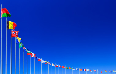 Flags against blue sky, copyspace