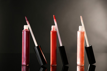 Beautiful lip glosses on dark background