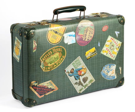Fototapeta Old vintage suitcase with travel labels