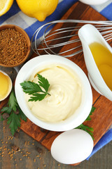 Mayonnaise ingredients on wooden background
