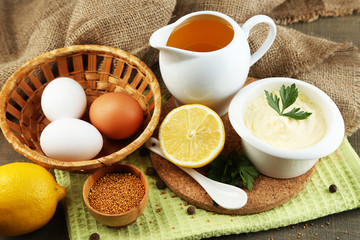 Mayonnaise ingredients on wooden background