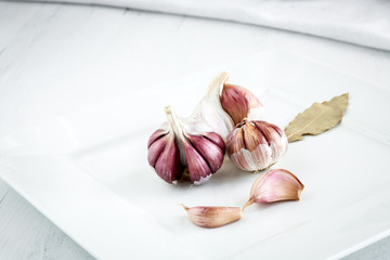 Garlics on wooden board