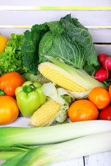 Vegetables on white wooden box background