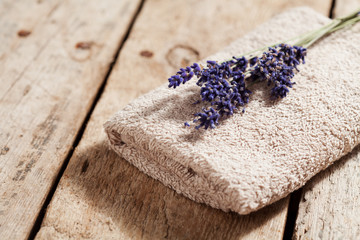 Obraz na płótnie Canvas Bouquet of lavender flowers on towel, spa concept
