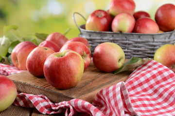 Naklejka na ściany i meble Sweet apples on table on bright background