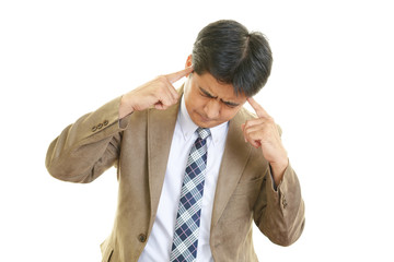 頭痛を訴えるビジネスマン