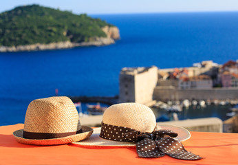 two hats on vacation in Europe - obrazy, fototapety, plakaty