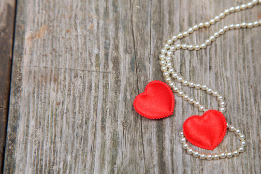 Two red hearts and beads