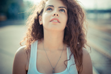 Close up of young woman standing on street