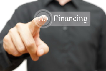 businessman pressing financing button. Credit or investment conc