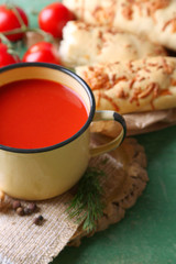 Homemade tomato juice in mug, spices and fresh tomatoes